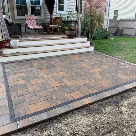 G3 completed paver patio beside a home