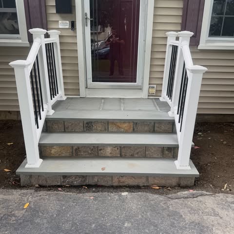 G3 completed stone front steps with white railings