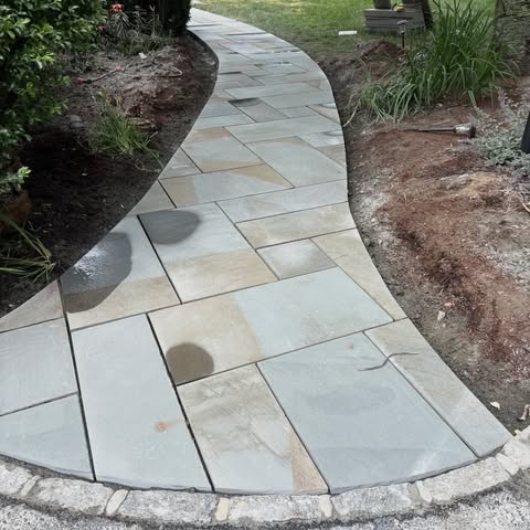 G3 curved flagstone walkway through a garden